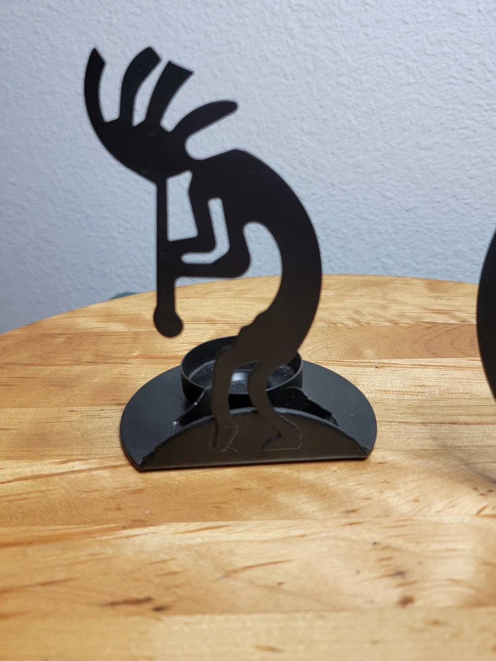 The Southwest Kokopelli Decorative Cast Iron Candle Holders are handmade in the
